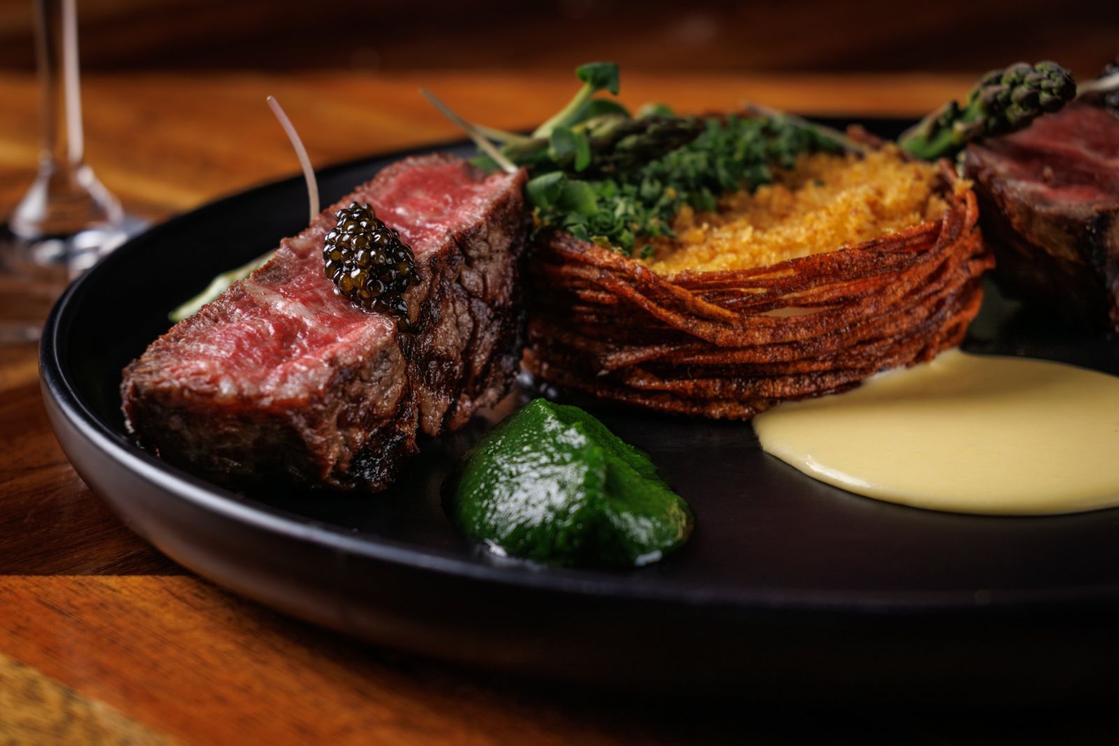 Sliced steak with caviar and a crisp potato cake at Butcher & The Bear