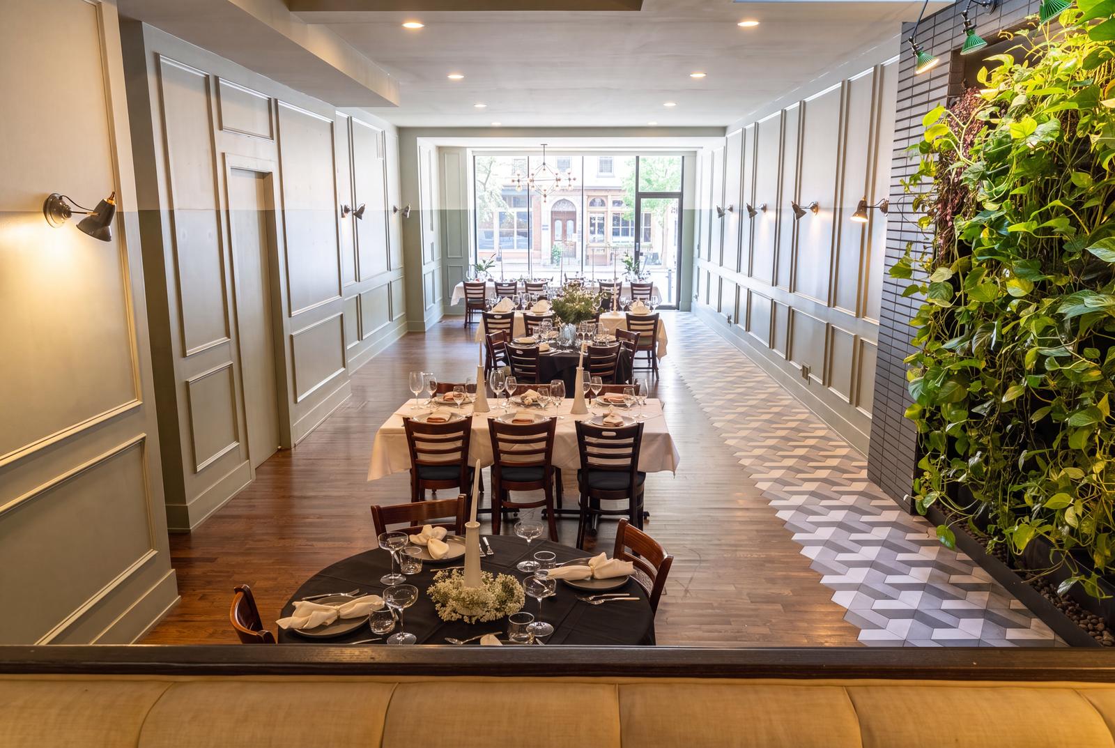 The dining room at Sala Chicago set with long tables